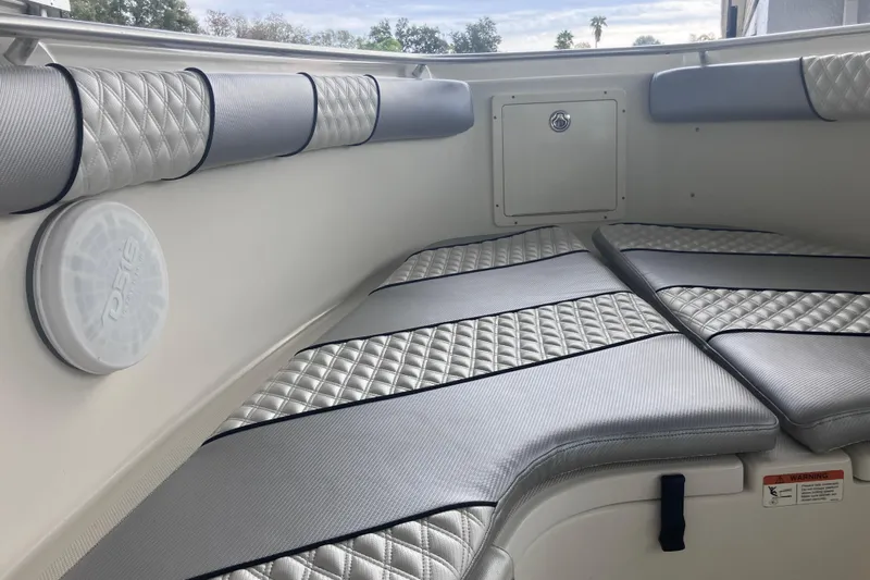  Yacht Photos Pics 2008 Hydra-Sports Vector 2900 CC boat interior with cushioned seating and speaker.