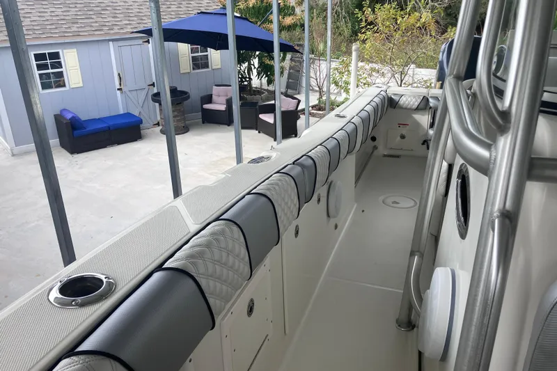  Yacht Photos Pics 2008 Hydra-Sports Vector 2900 CC boat interior with cushioned seating and outdoor patio view.