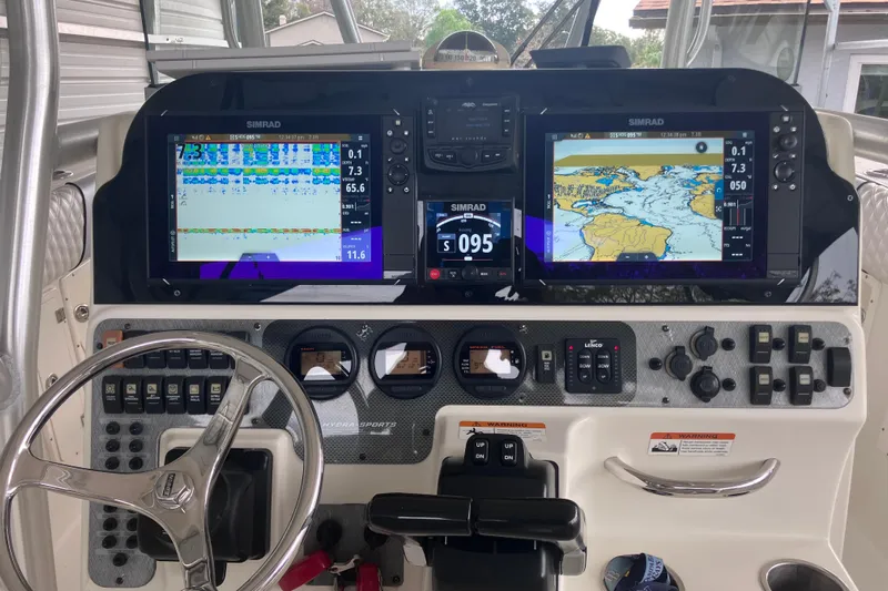  Yacht Photos Pics 2008 Hydra-Sports Vector 2900 CC dashboard with Simrad navigation displays and controls.