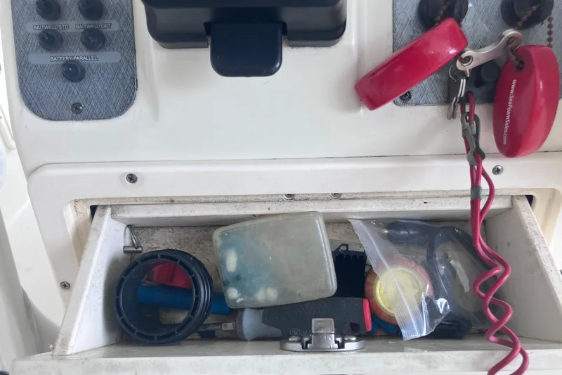  Yacht Photos Pics 2008 Hydra-Sports Vector 2900 CC console storage with keys and boating accessories.