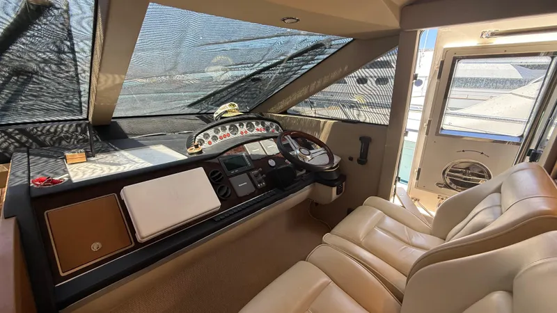  Yacht Photos Pics Interior helm of 2010 Princess 62 yacht with leather seats and control panel.