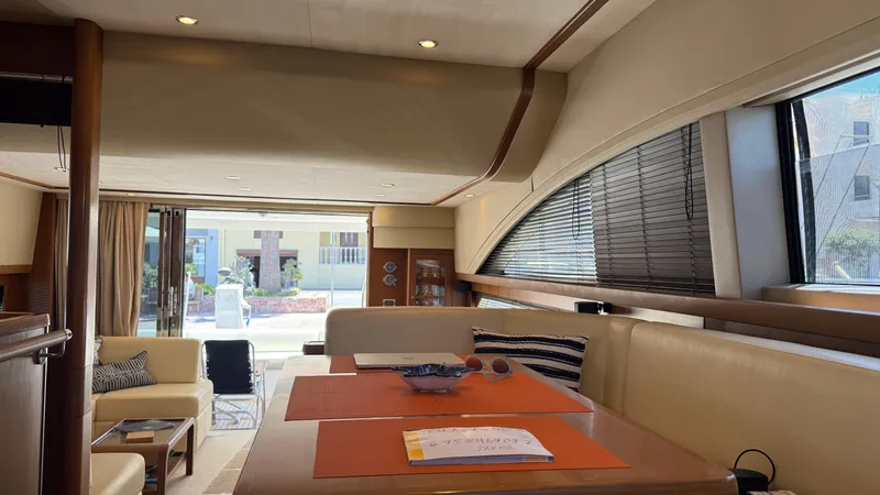  Yacht Photos Pics Luxurious interior of a 2010 Princess 62 yacht with elegant seating and large windows.