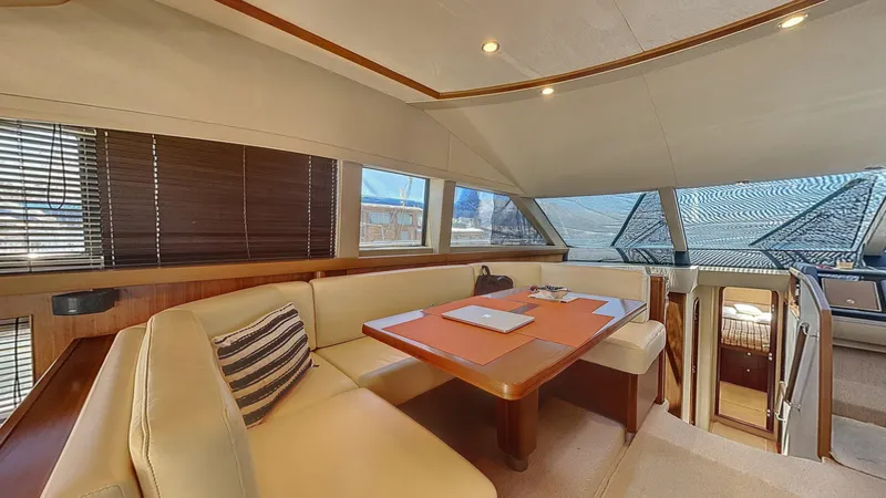  Yacht Photos Pics Luxurious interior of 2010 Princess 62 yacht with elegant seating and dining area.