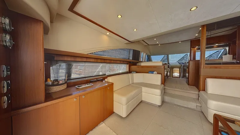  Yacht Photos Pics Luxurious interior of a 2010 Princess 62 yacht with elegant seating and wood finishes.