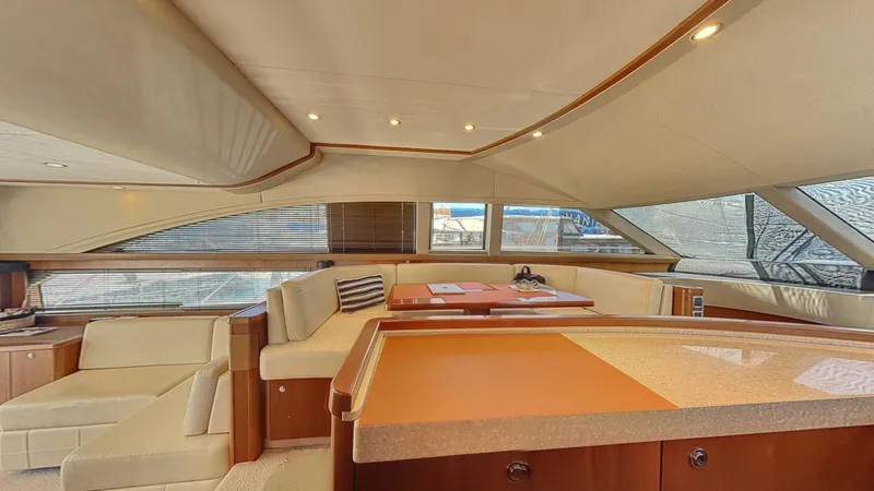  Yacht Photos Pics Luxurious interior of a 2010 Princess 62 yacht with elegant seating and modern design.
