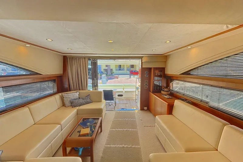  Yacht Photos Pics Luxurious interior of a 2010 Princess 62 yacht with elegant seating and modern decor.