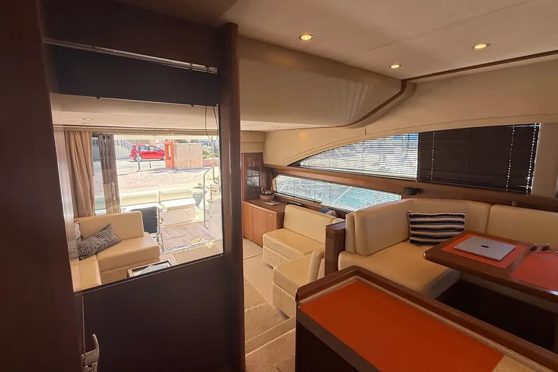  Yacht Photos Pics Luxurious interior of a 2010 Princess 62 yacht with elegant seating and modern decor.