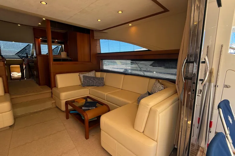 Yacht Photos Pics Luxurious interior of 2010 Princess 62 yacht with beige leather seating and wooden accents.