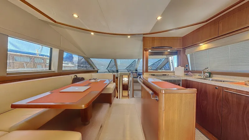  Yacht Photos Pics Luxurious interior of a 2010 Princess 62 yacht with modern kitchen and dining area.