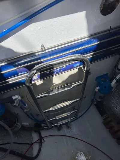Taco Truck Yacht Photos Pics Stainless steel ladder on a 1996 Prout 45 boat deck, with visible blue piping.