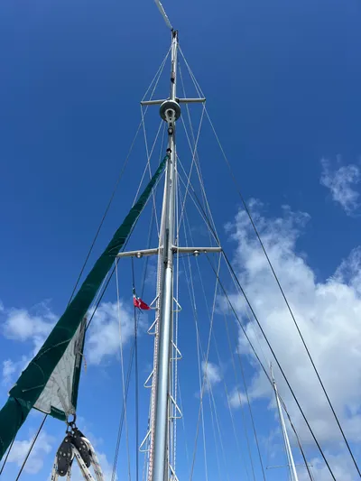 Taco Truck Yacht Photos Pics Sailboat mast of a 1996 Prout 45 against a clear blue sky.