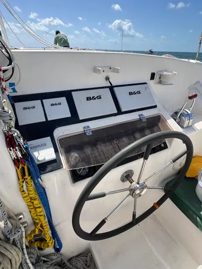 Taco Truck Yacht Photos Pics Sailboat cockpit with steering wheel, navigation instruments, and ropes; Prout 45, 1996 model.