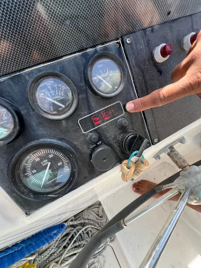 Taco Truck Yacht Photos Pics Control panel of a 1996 Prout 45 boat with gauges and a pointing hand.