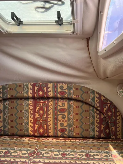 Taco Truck Yacht Photos Pics Interior of a 1996 Prout 45 boat with patterned upholstery and window.