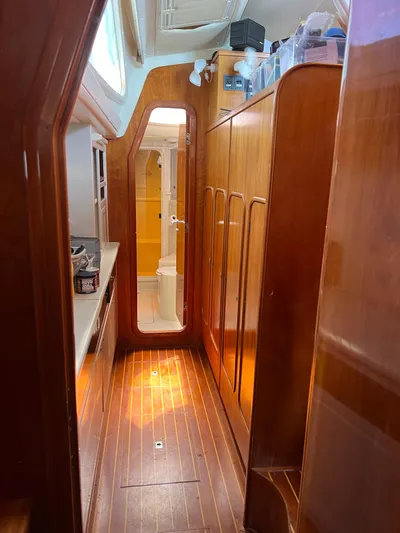 Taco Truck Yacht Photos Pics Interior of a 1996 Prout 45 yacht with wooden flooring and cabinetry.