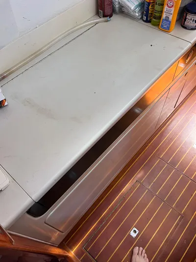 Taco Truck Yacht Photos Pics Interior view of a 1996 Prout 45 boat showing a countertop and storage area.