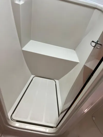 Taco Truck Yacht Photos Pics Compact shower area inside a 1996 Prout 45 boat, featuring a sleek, minimalist design.