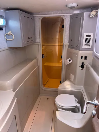 Taco Truck Yacht Photos Pics 1996 Prout 45 yacht bathroom with shower, toilet, and storage cabinets.