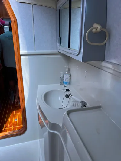 Taco Truck Yacht Photos Pics Bathroom interior of a 1996 Prout 45 yacht with sink and mirror.