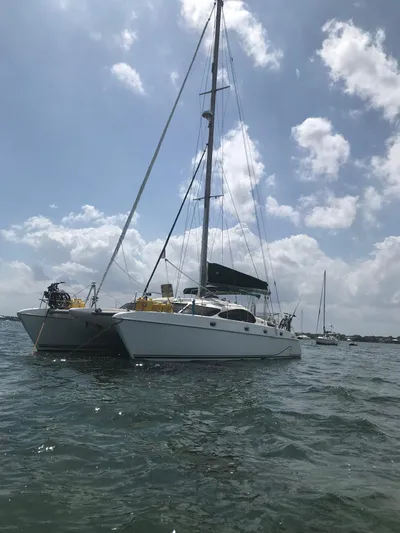 Taco Truck Yacht Photos Pics 1996 Prout 45 catamaran sailing on a sunny day with scattered clouds.