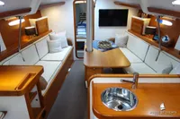 Luxurious Von Ahlen 403 yacht interior, featuring elegant wood finishes and cozy seating, 2014 model.