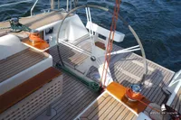 Steering wheel of 2014 Von Ahlen 403 yacht with wooden deck and ropes.