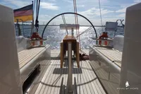 Deck view of 2014 Von Ahlen 403 yacht with German flag and ocean backdrop.