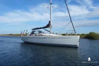 Sailing yacht Von Ahlen 403, 2014 model, cruising on calm waters under a clear sky.