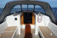 Cockpit of 2014 Von Ahlen 403 yacht with wooden accents and ocean view.