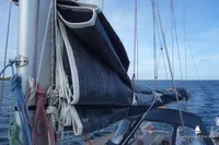 Sailboat with folded sail, Von Ahlen 403, 2014 model, on open water.