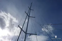 Tall yacht mast against cloudy sky, Von Ahlen 403, 2014 model.