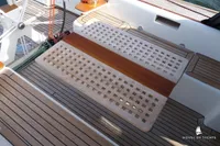 Teak deck of Von Ahlen 403 yacht, featuring elegant woodwork and nautical design elements.