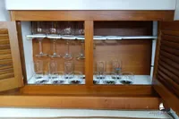 Wooden cabinet with glassware storage on a Von Ahlen 403 yacht, 2014 model.