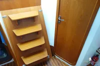 Wooden interior of Von Ahlen 403 yacht, featuring steps and a door, 2014 model.