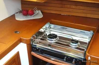 Wooden yacht kitchen with a two-burner stove, fruit bowl, and sleek design, Von Ahlen 403, 2014.