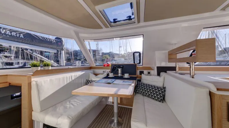 Escape Yacht Photos Pics Interior of 2016 Nautitech 40 Open catamaran with modern seating and dining area.