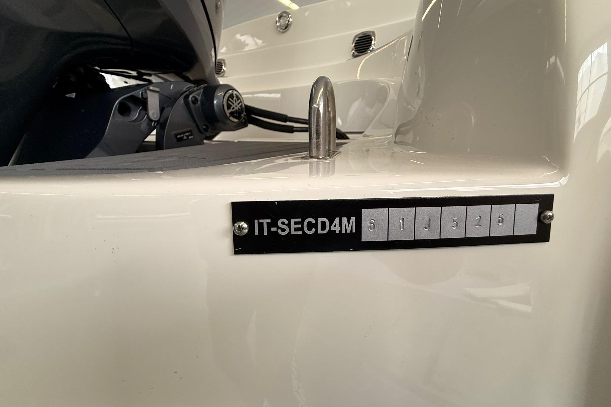 Close-up of a boat's identification plate with code "IT-SECD4M 611526".