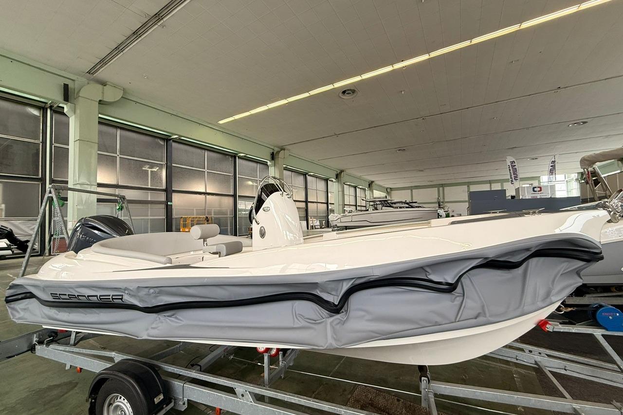 Modern Scanner ENVY 630 boat on trailer in indoor showroom, 2025 model.