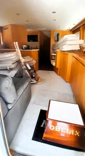  Yacht Photos Pics Interior of 2000 Hatteras 60 Convertible yacht with stacked cushions and a guitar.