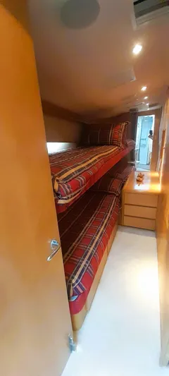  Yacht Photos Pics Bunk beds in 2000 Hatteras 60 Convertible yacht cabin with plaid bedding.