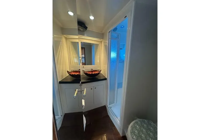 On Your Mark Yacht Photos Pics Luxurious bathroom interior of a 2005 Jefferson Motoryacht with elegant lighting and modern fixtures.