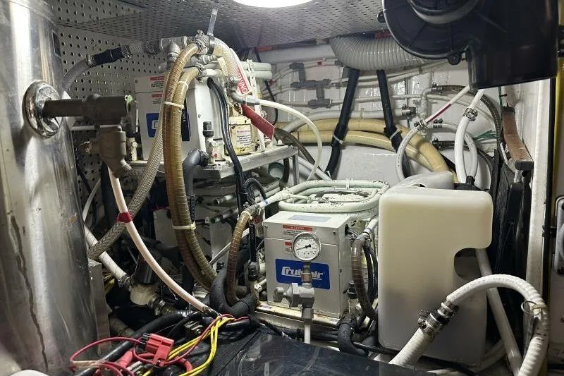 On Your Mark Yacht Photos Pics Engine room of a 2005 Jefferson Motoryacht with complex machinery and wiring.