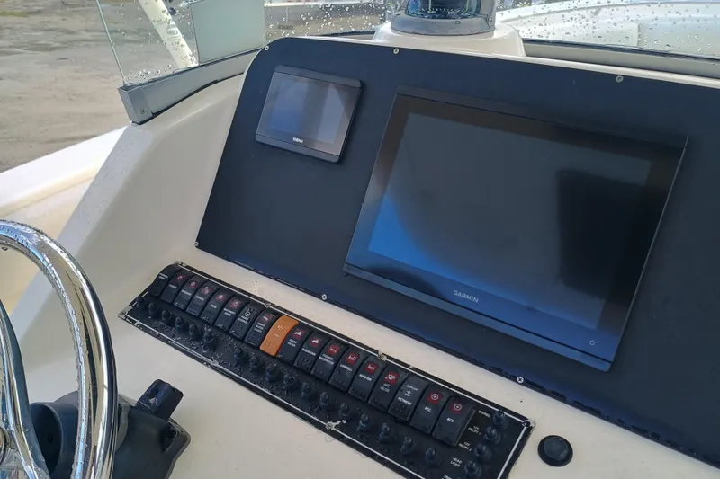 S28-117 Brokerage Joe Yacht Photos Pics Control panel of 2010 Pursuit S 280 Sport boat with Garmin display.