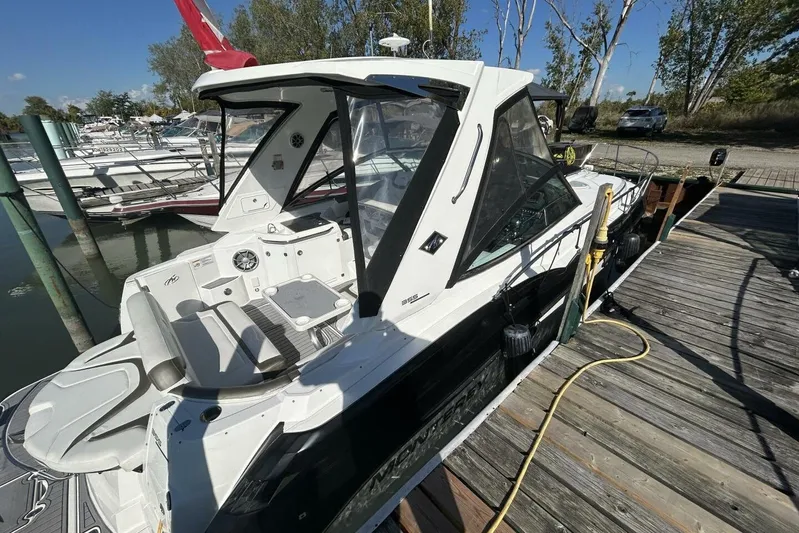  Yacht Photos Pics 2015 Monterey 355 Sport Yacht docked, showcasing sleek design and spacious deck.