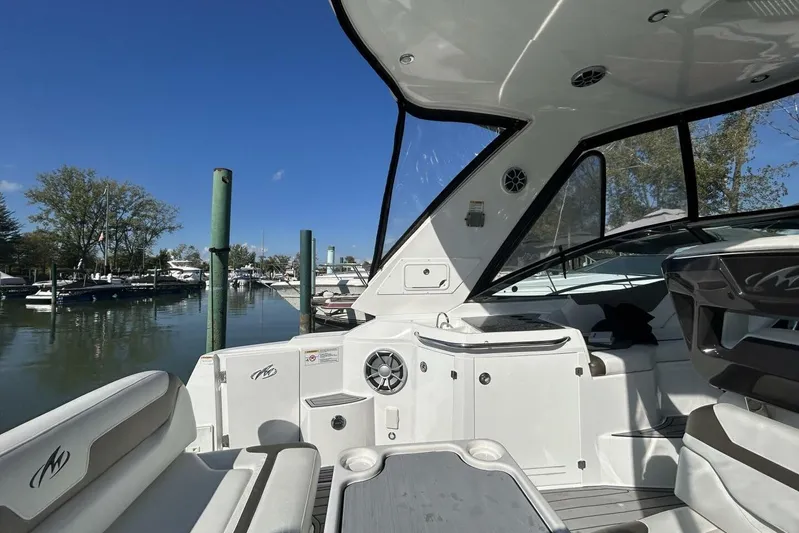  Yacht Photos Pics 2015 Monterey 355 Sport Yacht interior with seating and marina view.