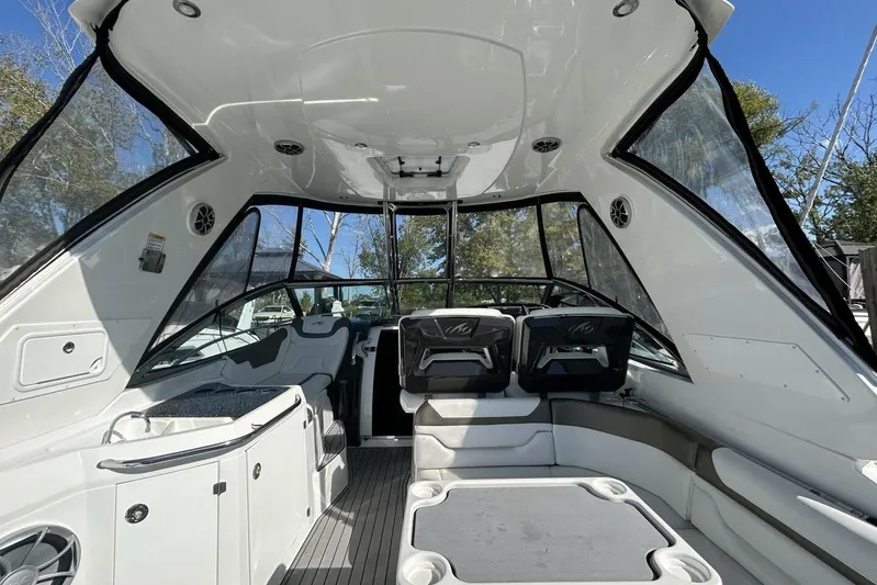  Yacht Photos Pics 2015 Monterey 355 Sport Yacht interior with seating and helm, featuring sleek design.