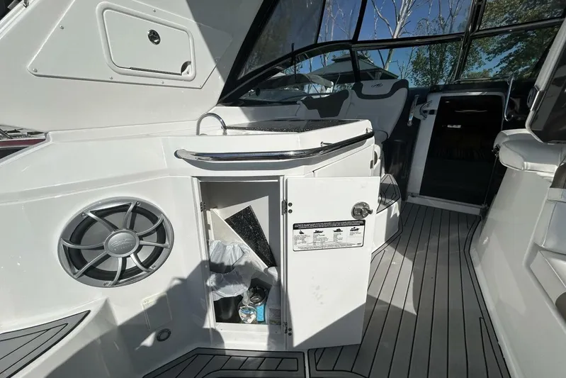 Yacht Photos Pics Interior of a 2015 Monterey 355 Sport Yacht with open cabinet and speaker.