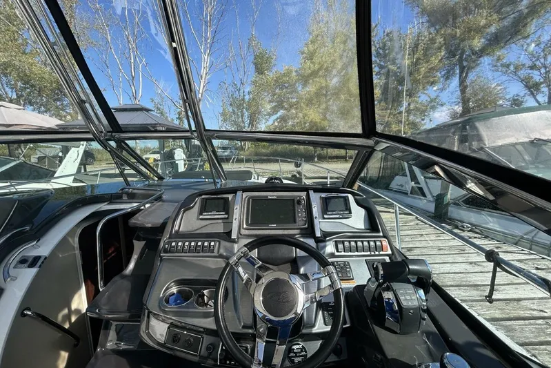  Yacht Photos Pics Cockpit view of 2015 Monterey 355 Sport Yacht with modern controls and steering wheel.