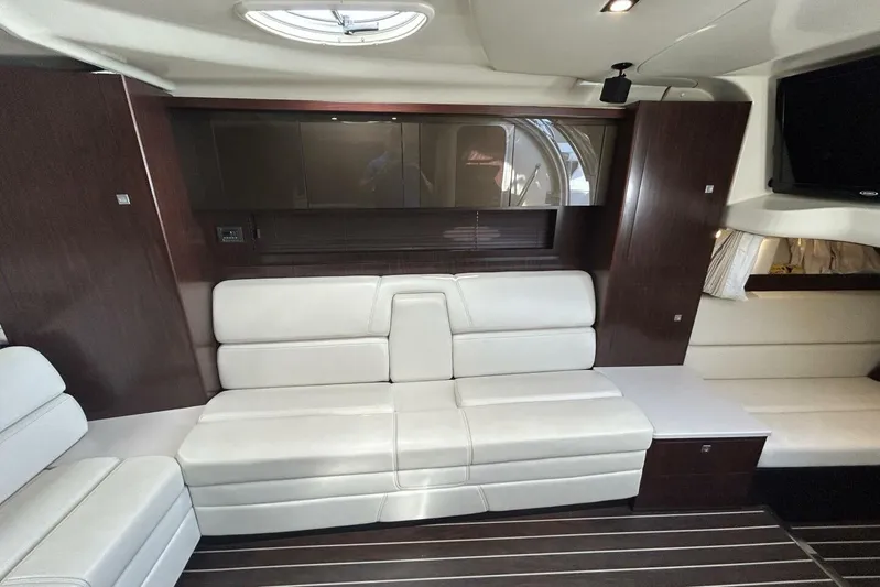  Yacht Photos Pics Interior of 2015 Monterey 355 Sport Yacht with white leather seating and dark wood accents.