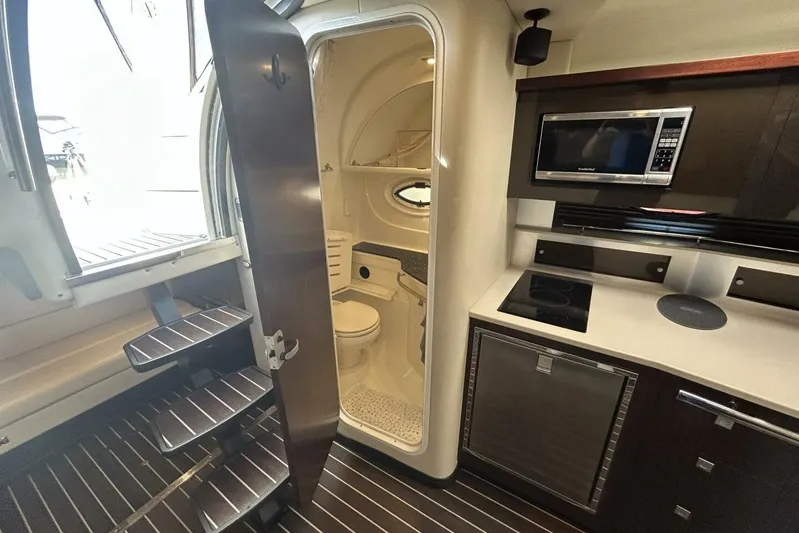  Yacht Photos Pics Interior of 2015 Monterey 355 Sport Yacht with kitchenette and bathroom.